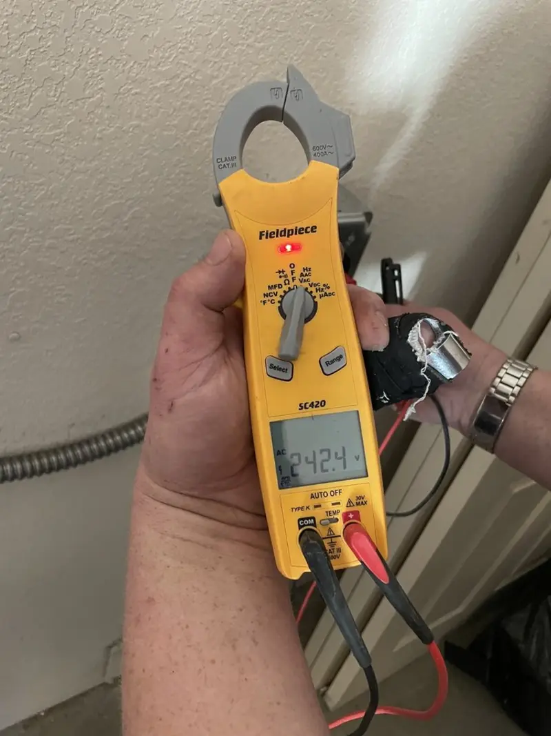 Voltage testing with clamp meter during Outlet Installation in Dyersburg